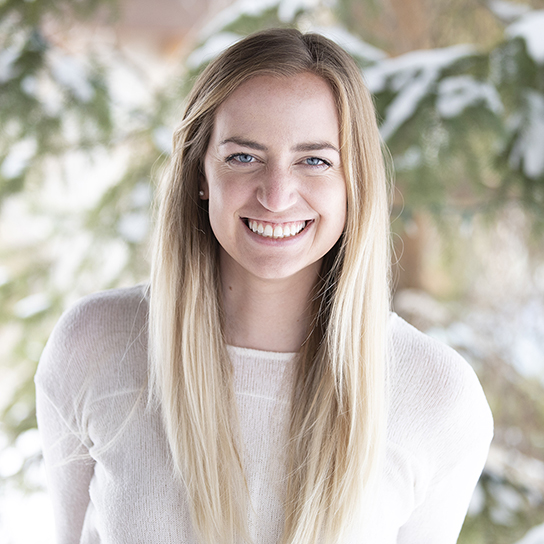 Woman Smiling in White Shirt