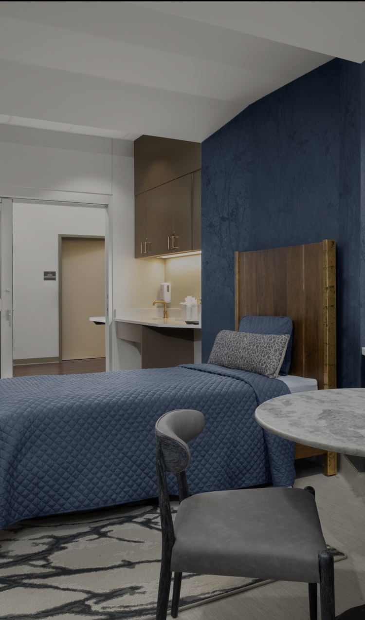 A detox room at All Points North Denver with table and luxury mattress