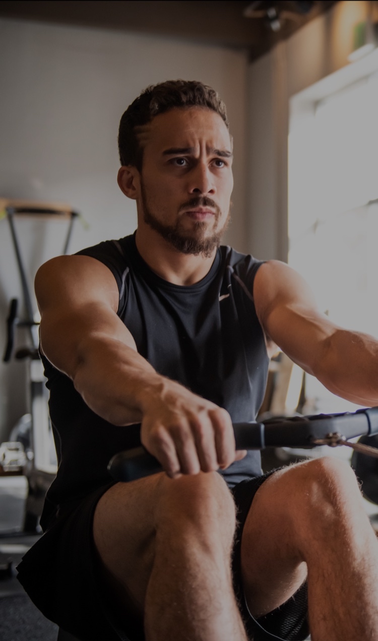 A client workouts on the rowing machine at All Points North Lodge.